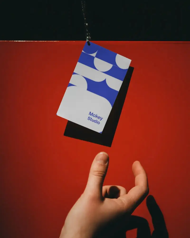 Floating Business Card Mockup Display Over Red Background For Creative Professional Presentation