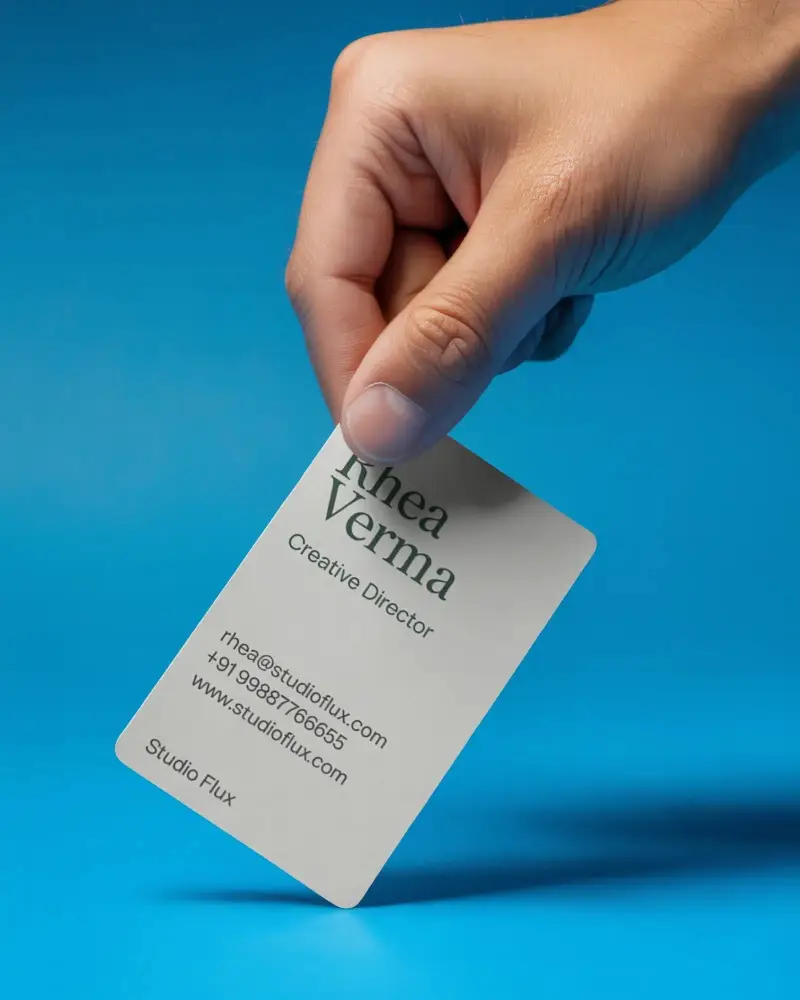 Vertical Business Card Mockup With Rounded Corners Held In Fingers On Solid Background