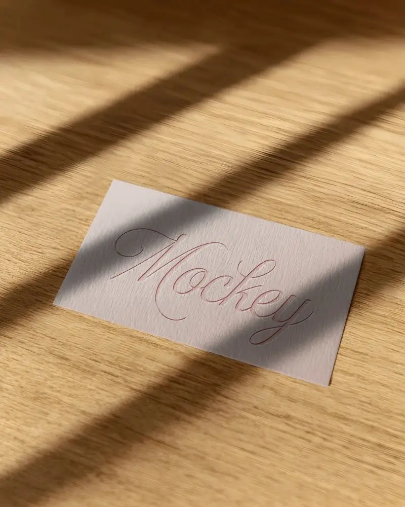 Detailed Closeup Business Card Mockup With Wood Grain Background And Light Play