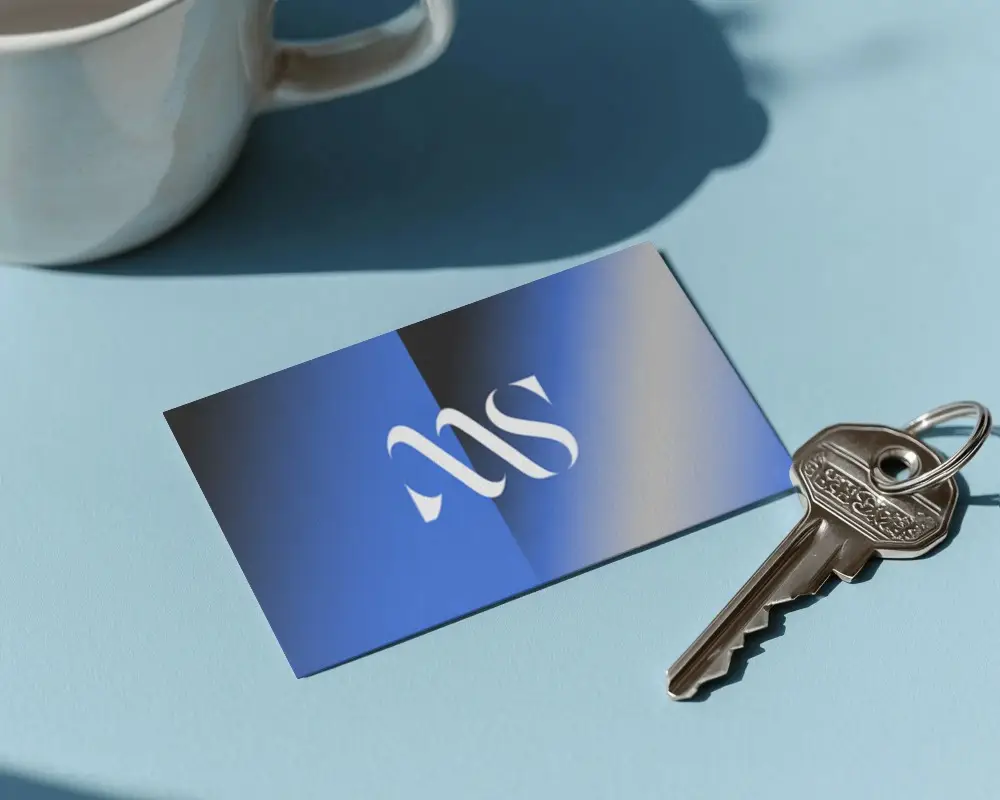 Horizontal Business Card On Solid Surface With Key And Subtle Shadows For Branding