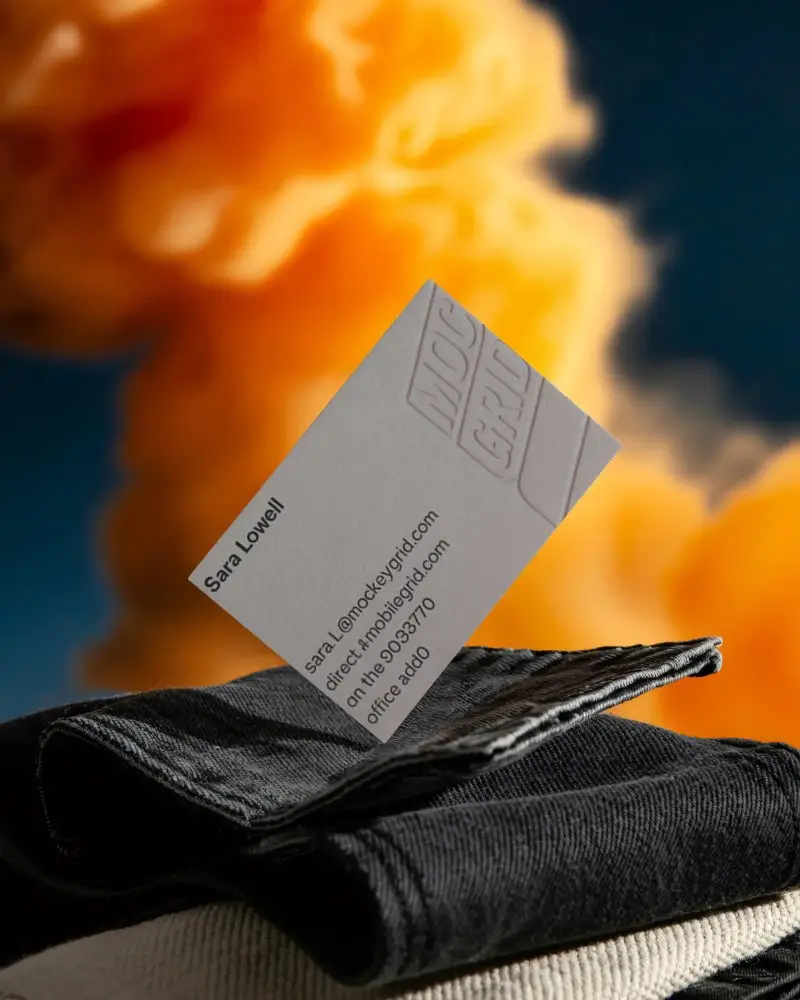 Sleek Floating Business Card Mockup With Textured Fabric And Soft Focused Vibrant Background