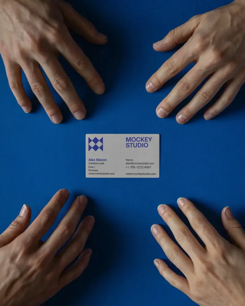 Creative Business Card Mockup With Multiple Hands Hovering Over Blank Design Space