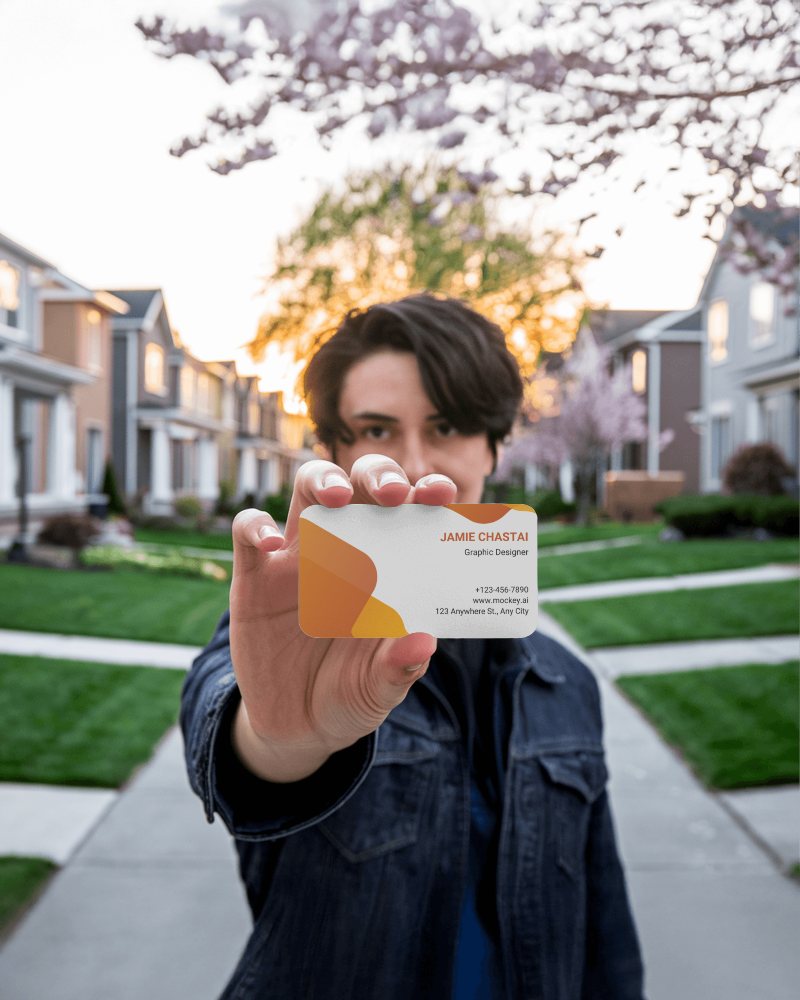 Graphic Designer Business Card Mockup Presented By Male Model Outdoors