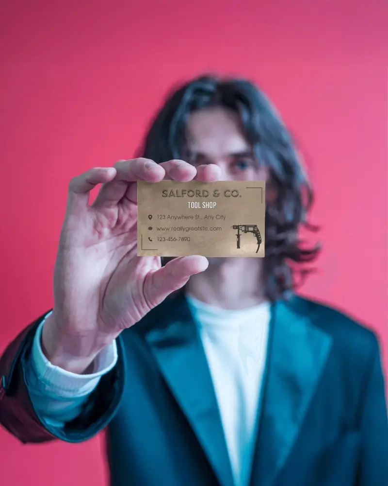 Professional Business Card Mockup With Man In Blazer Presenting Card To Camera Against Vivid Backdrop