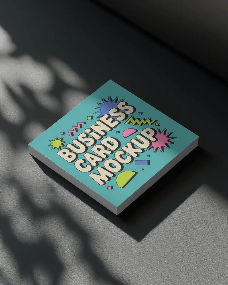 Shadowed Square Business Card Mockup Floating On Dark Textured Surface With Dappled Natural Light