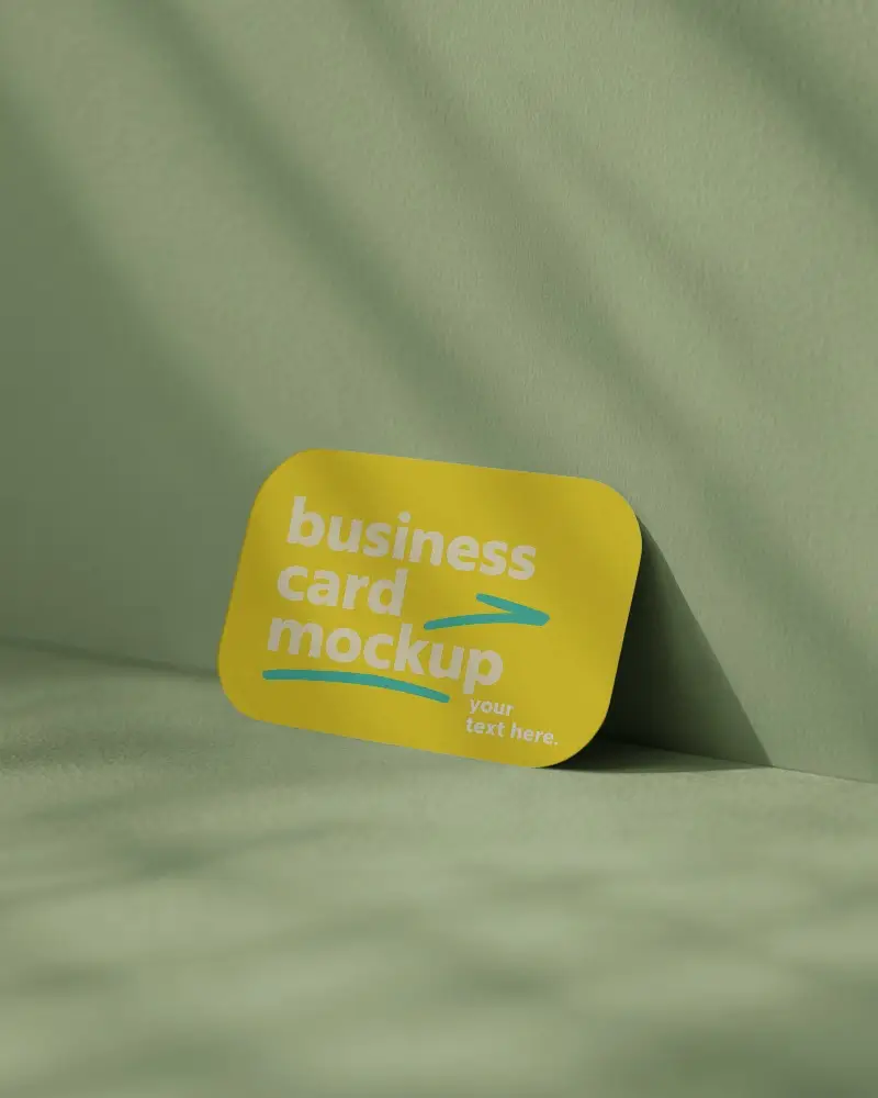 Rounded Corner Business Card Mockup Standing On Textured Green Fabric Background With Soft Dappled Light