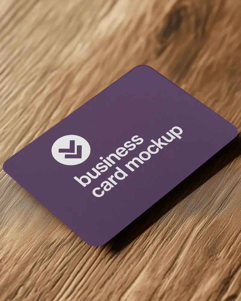 Angled Rectangular Business Card Mockup On Textured Wooden Surface With Natural Light And Shadows