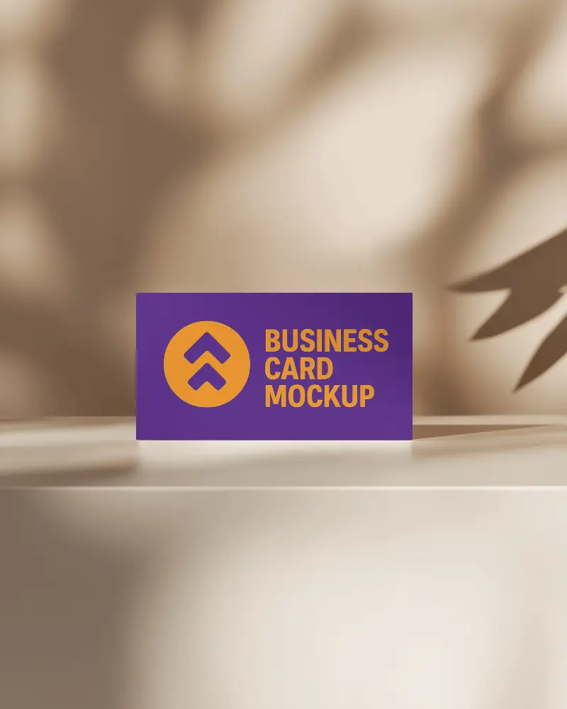 Horizontal Business Card Mockup Standing On Light Podium With Leaf Shadows Warm Neutral Background Modern Brand Presentation With Minimal Nature Inspired Aesthetic
