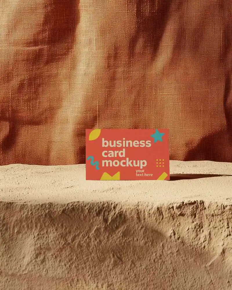 Sandy Rock Platform Business Card Mockup Horizontal Orientation Against Metallic Orange Fabric Texture Dramatic And Earthy Brand Setting