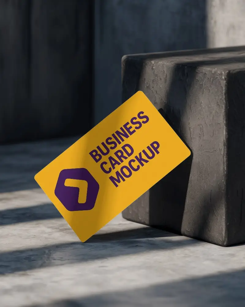 Dark Moody Stone Surface Business Card Mockup Leaning Against Textured Block In Minimal Shadow Light