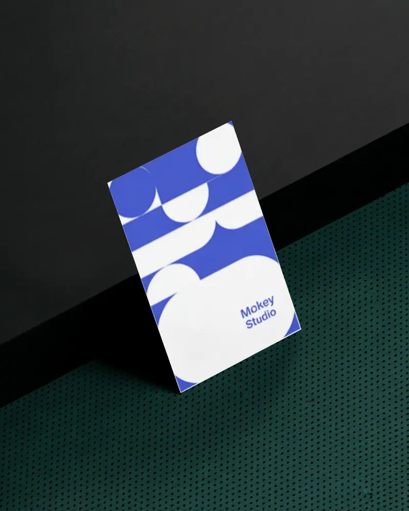 Vertical Business Card Mockup On Black Shelf And Green Perforated Metal