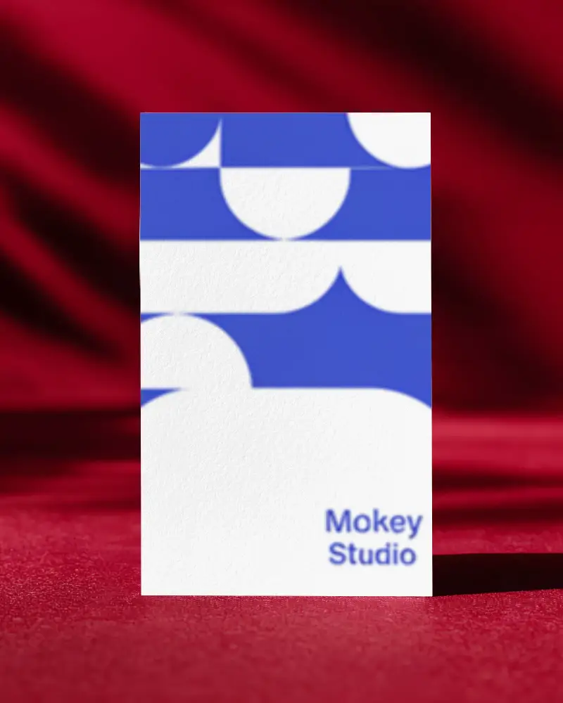 Vertical Business Card Mockup On Red Fabric Background Bold And Elegant Presentation