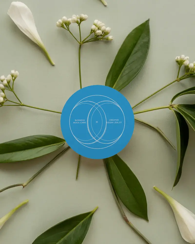Floral Circle Business Card Mockup Round Card Surrounded By Green Leaves And White Petals