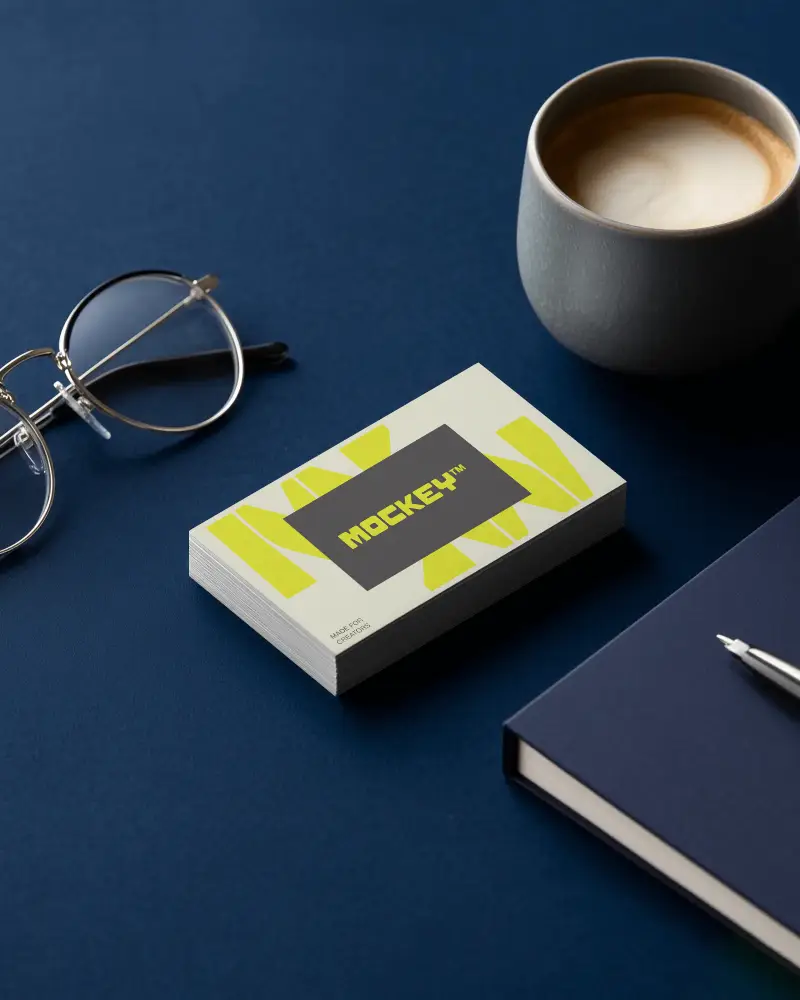 Workspace Stack Horizontal Business Card Mockup With Glasses Coffee Cup And Blue Desk Setup