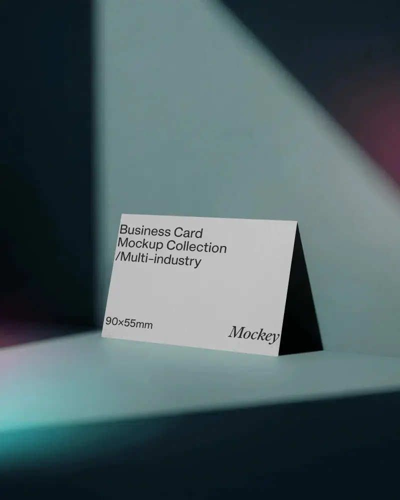 Dual Color Lighting Business Card Mockup Against Blue Wall With Dramatic Shadows