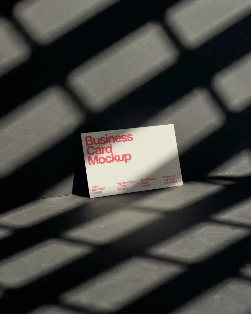 Dramatic Shadow Business Card Mockup On Dark Floor With Angled Grid Lighting