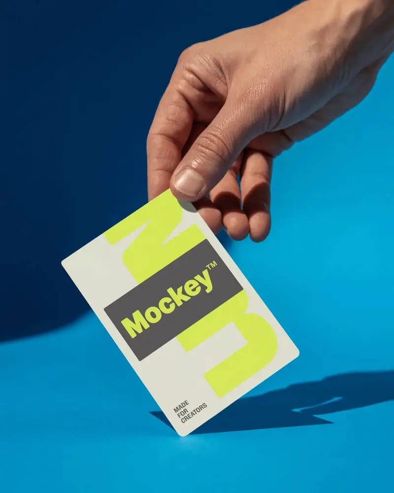 Clean Minimalist Blank Business Card Mockup In Hand Against Solid Background Perfect For Design