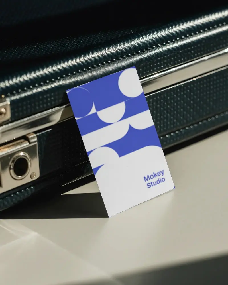 Vertical Business Card Mockup Standing Attached To Industrial Metal Briefcase Closeup Angle