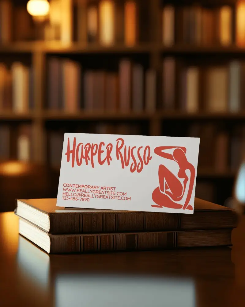 Elegant Business Card Mockup On Stack Of Hardcover Books Against Blurred Bookshelf Background