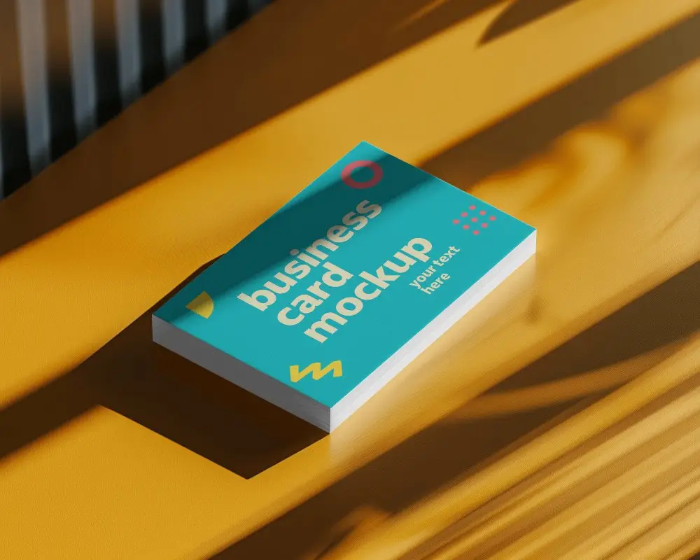 Yellow Table Business Card Mockup With Warm Lighting