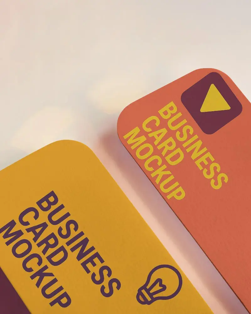 Elegant Vertical Business Card Mockup On Reflective Blush Surface With Soft Bokeh Lighting Rounded Corners And Premium Texture 0194