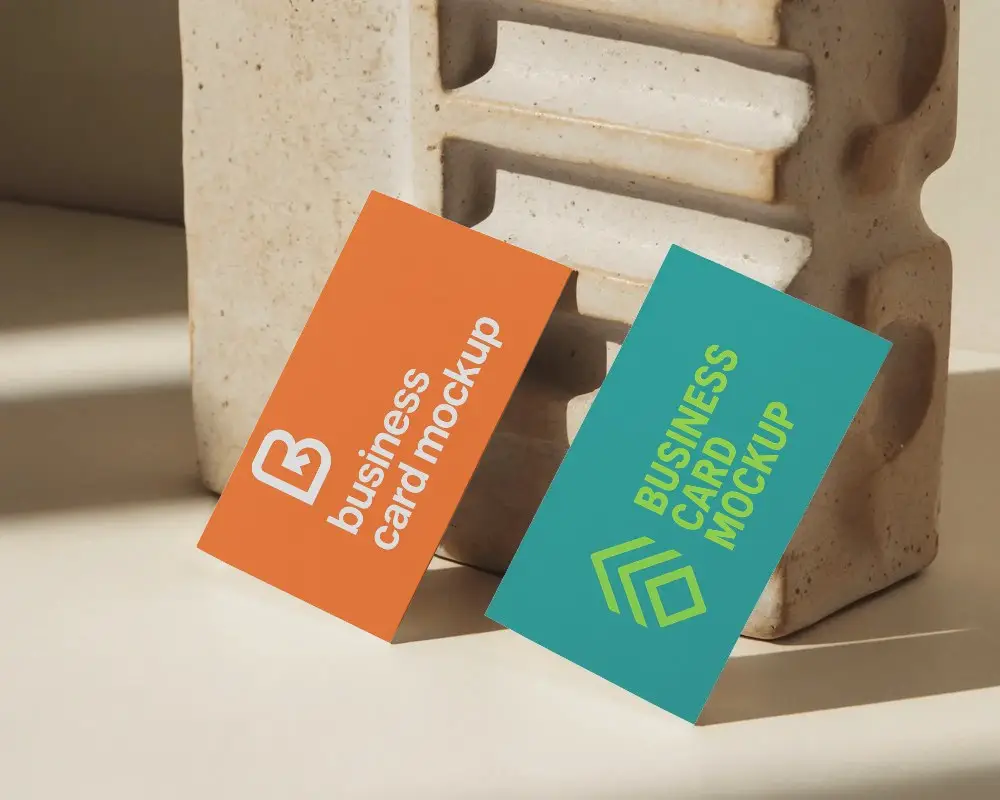 Sunlit Stone Texture Business Card Mockup Two Cards Leaning On Sculptural Ceramic Block 0203