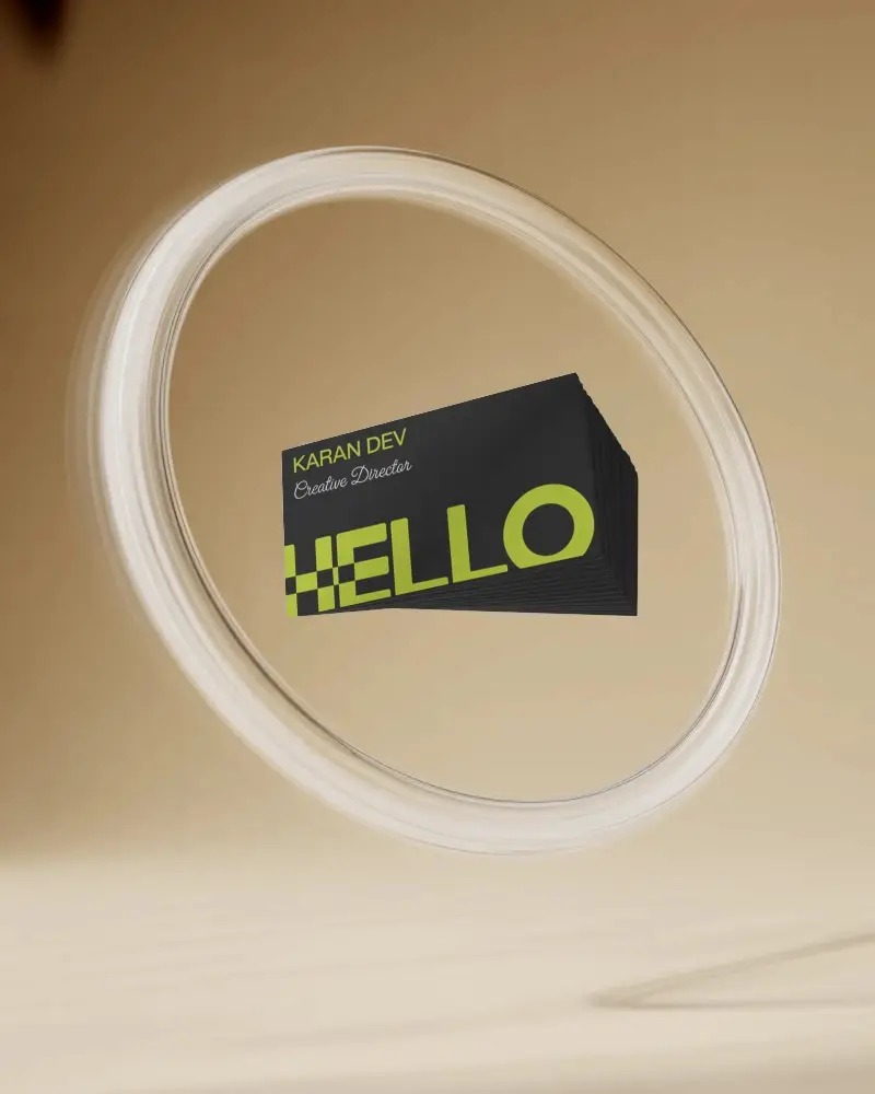floating-business-card-stack-mockup-inside-glowing-ring-on-soft-gradient-beige-background