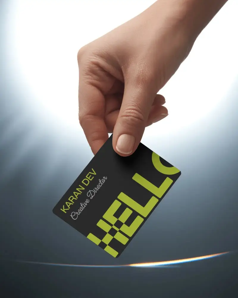 downward-angle-business-card-mockup-natural-hand-position-with-glowing-arch-light