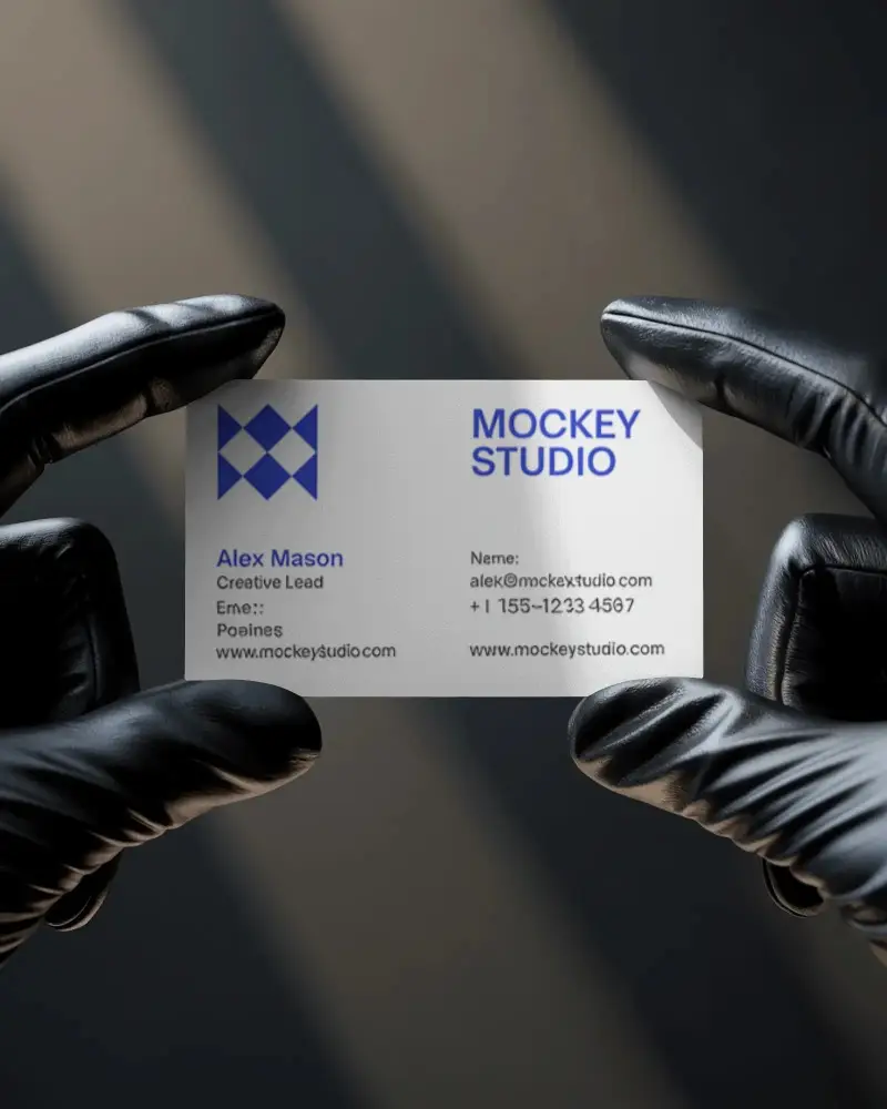 closeup-business-card-showcase-held-with-gloves-under-minimal-hard-light-studio-effect