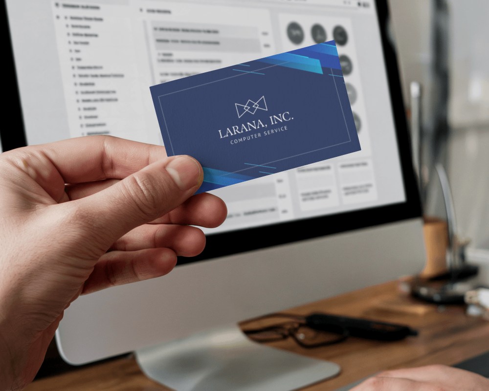 Business Card Mockup In Hand With Desktop Setup Organized And Professional Workspace