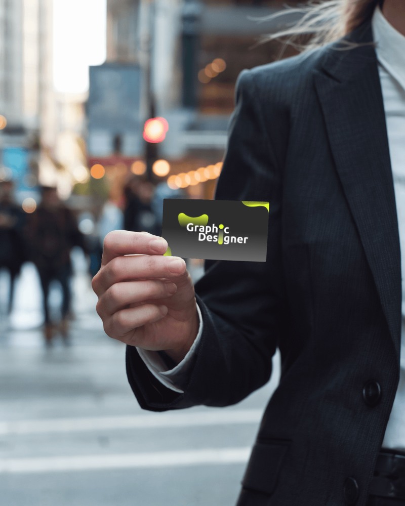 Business Card Mockup In Hand On Busy Street Background Urban And Dynamic Look