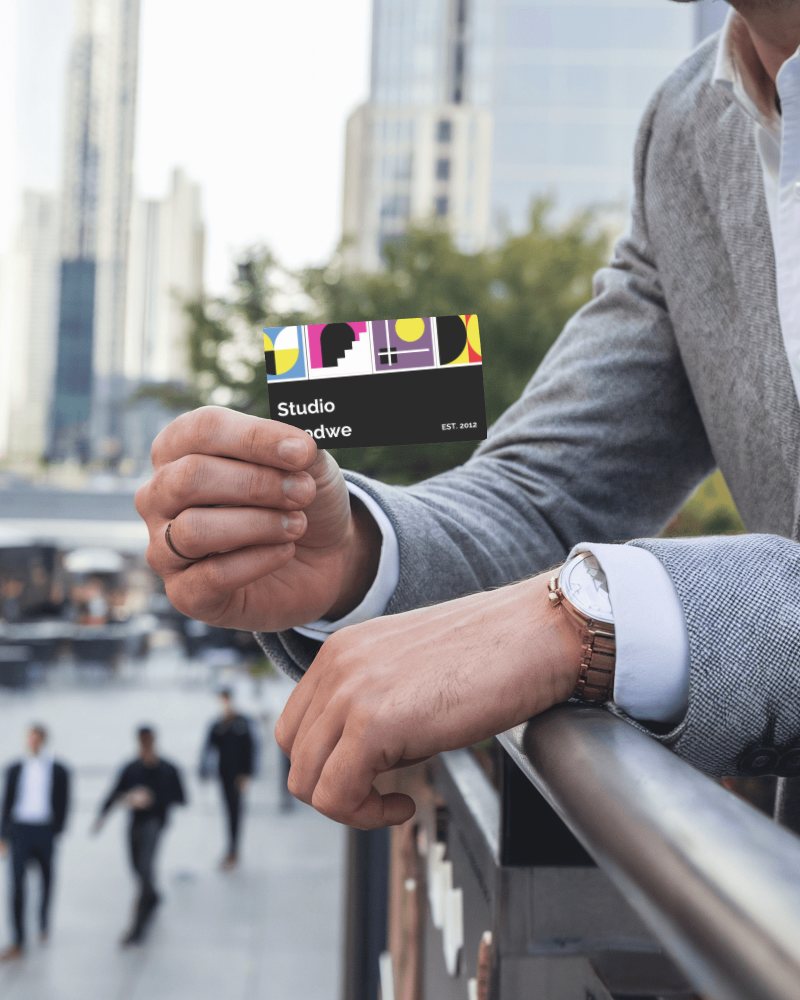 Business Card Mockup In Hand With Cityscape Background Elegant And Professional Design