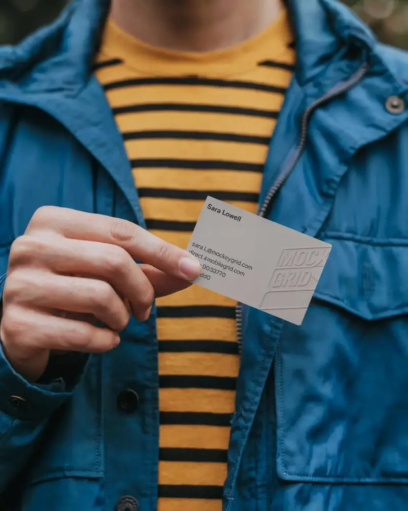 Person Holding Business Card Mockup For Branding And Marketing Presentation