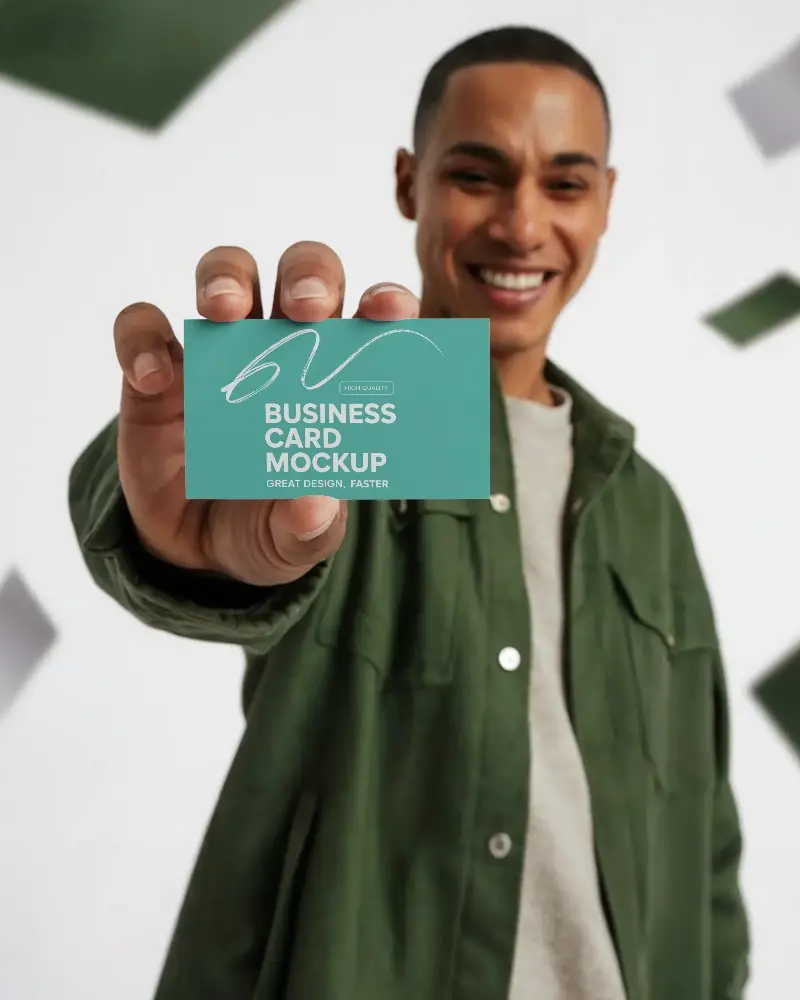 Smiling Man Holding Business Card Mockup For Professional Brand Presentation