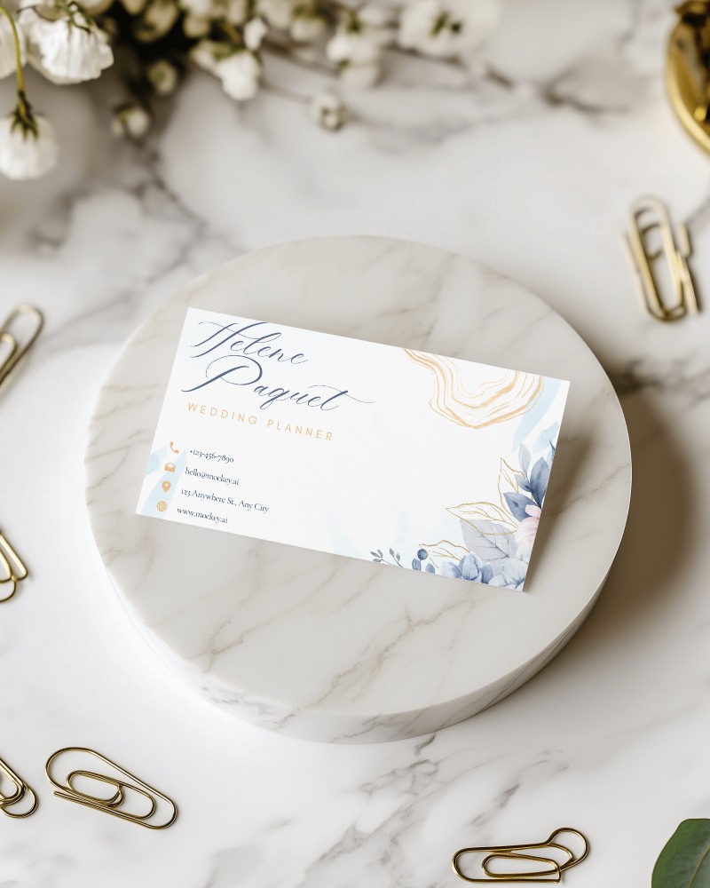 Classy Business Card Mockup On Marble Surface Surrounded By Paperclips And Plants