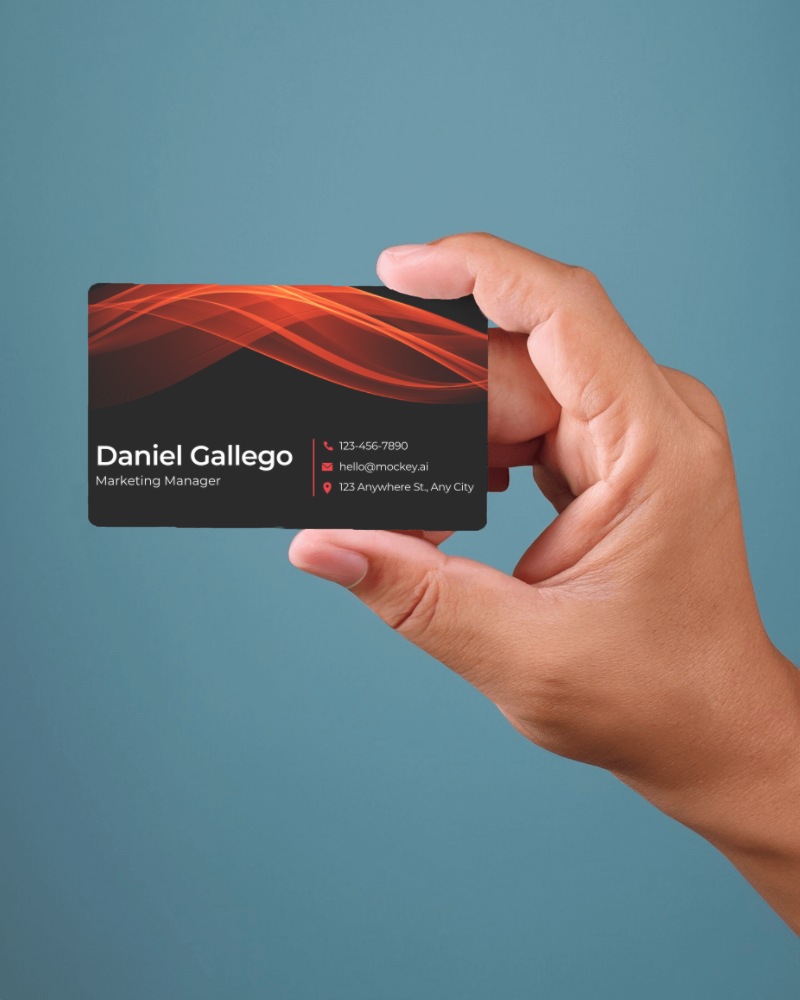 Close Up Of Hand Presenting Business Card Mockup On Blue Background