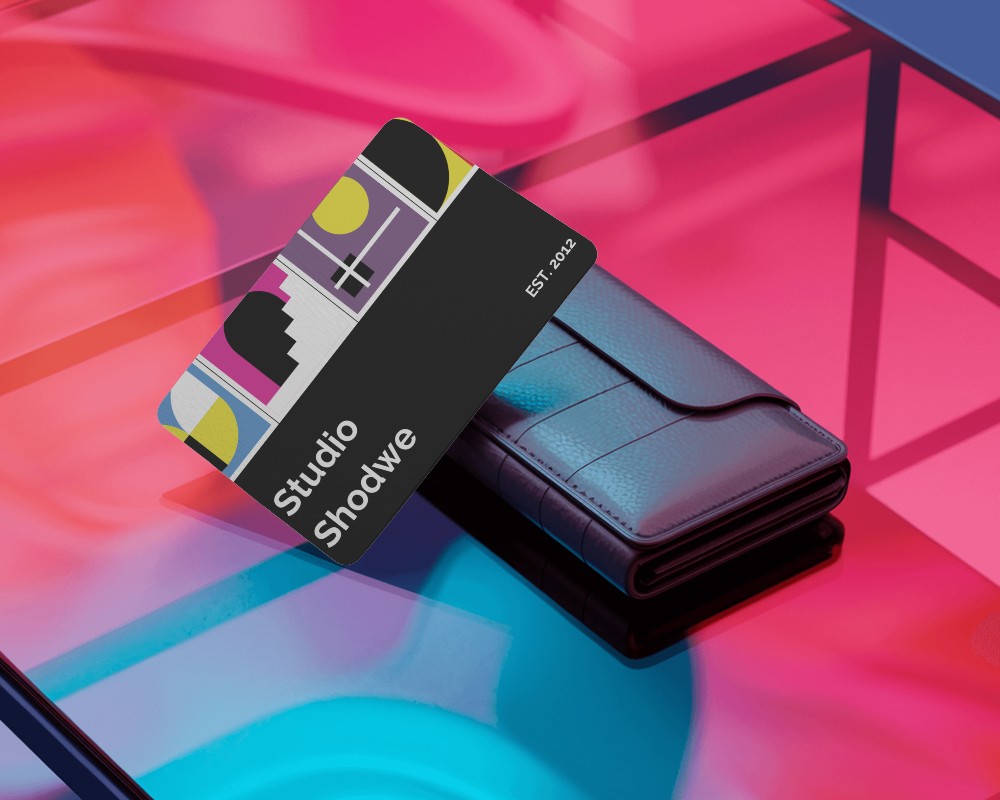 Elegant Business Card On Wallet Placed In Vivid Neon Setup For Striking Visual Presentation