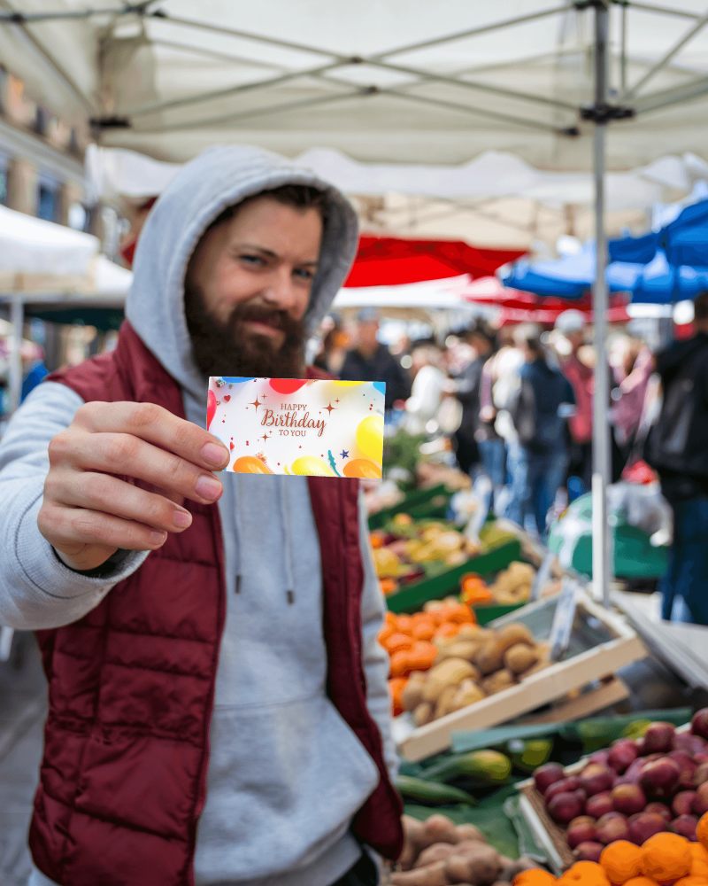 Outdoor Market Business Card Mockup Casual Look Hand Holding Card In Open Market Background