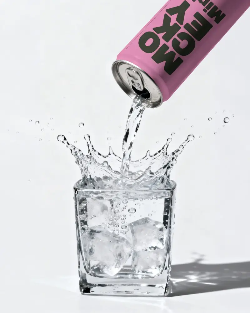 Beverage Pour Can Mockup With Splash Effect Glass Ice Cubes High Speed Capture