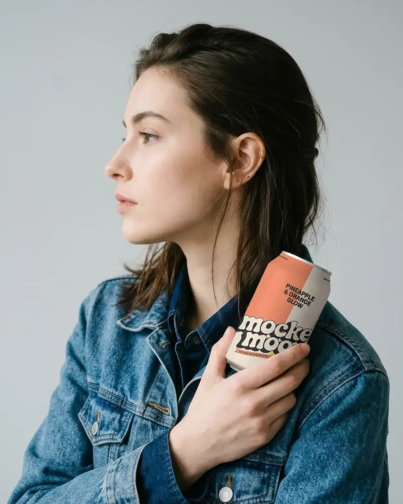 Woman Holding Blank Can Mockup For Product Packaging Design Presentation
