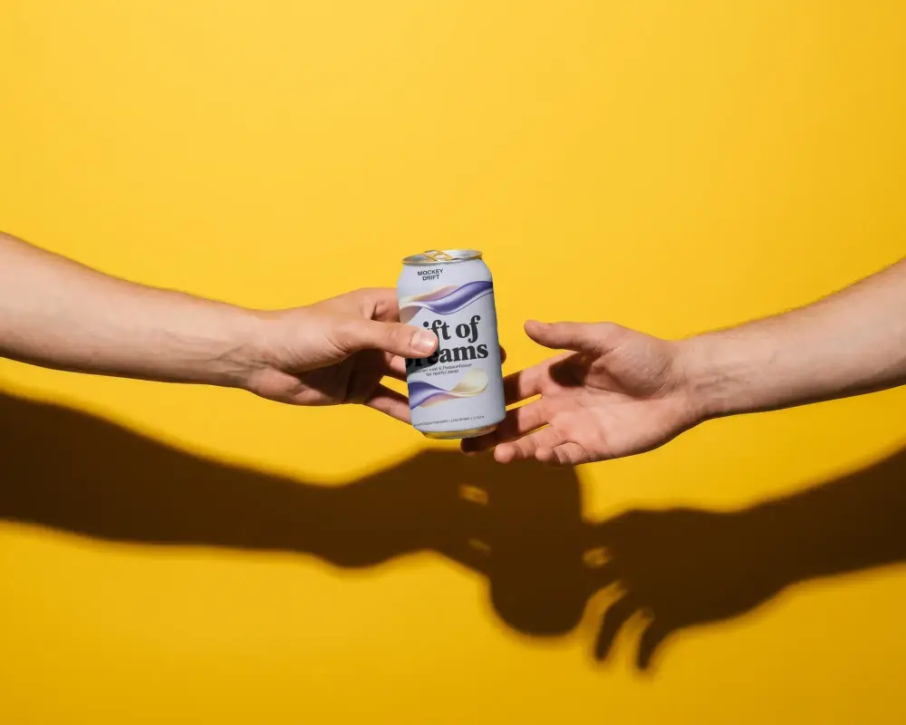 Hands Passing Metal Can Mockup On Vibrant Solid Background For Product Presentation