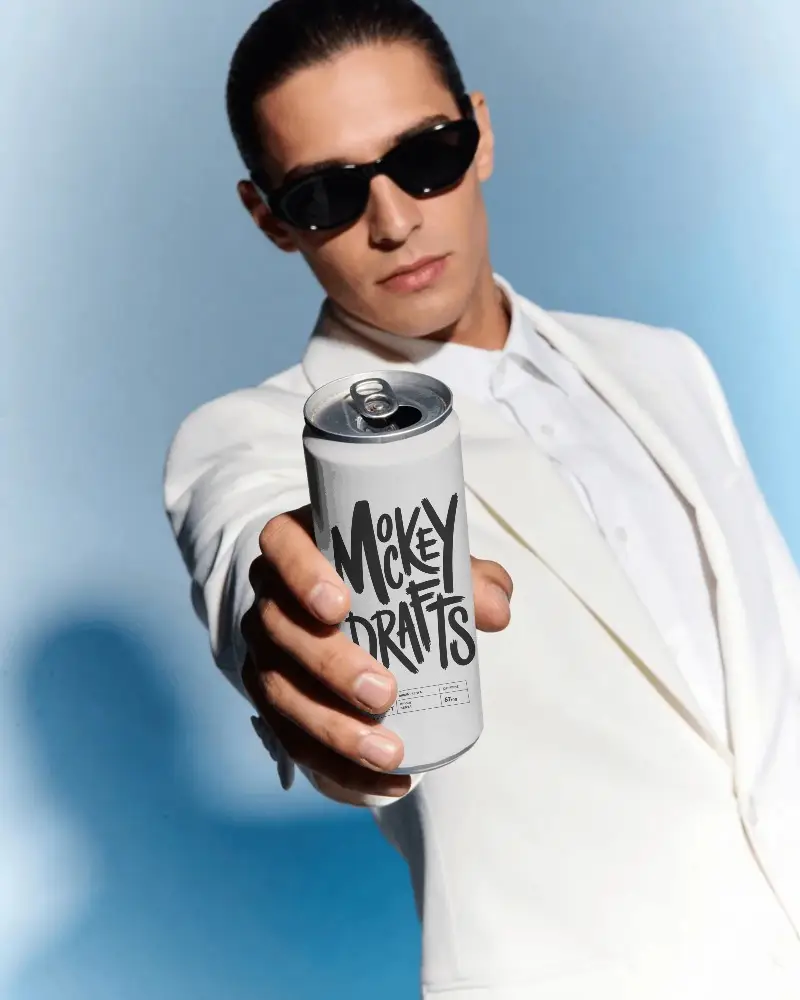 Man Holding Sleek Tall Slim Can Mockup For Beverage Advertising Or Promotional Content