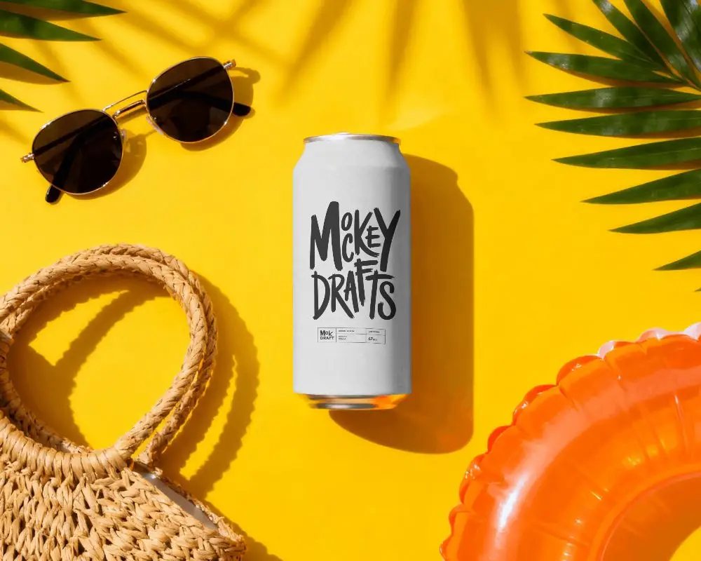 Sunny Tropical Can Mockup On Yellow Background With Sunglasses Straw Bag And Pool Float Summer
