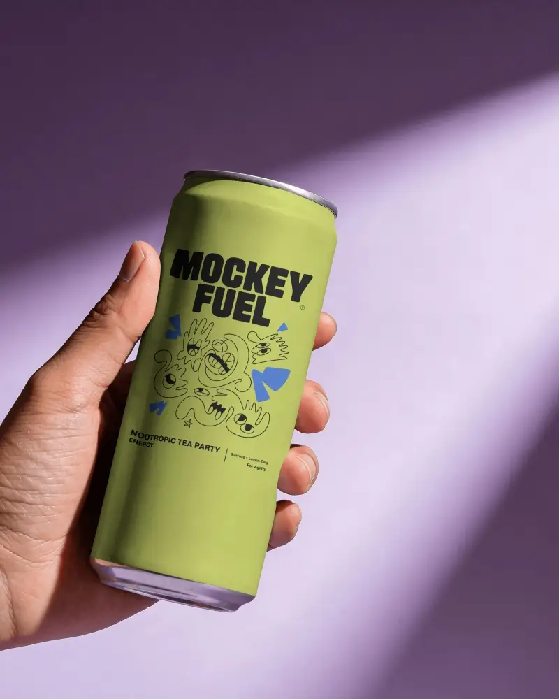 Handheld Beer Can Mockup On Purple Studio Background With Blank Label Area And Dramatic Light Beam