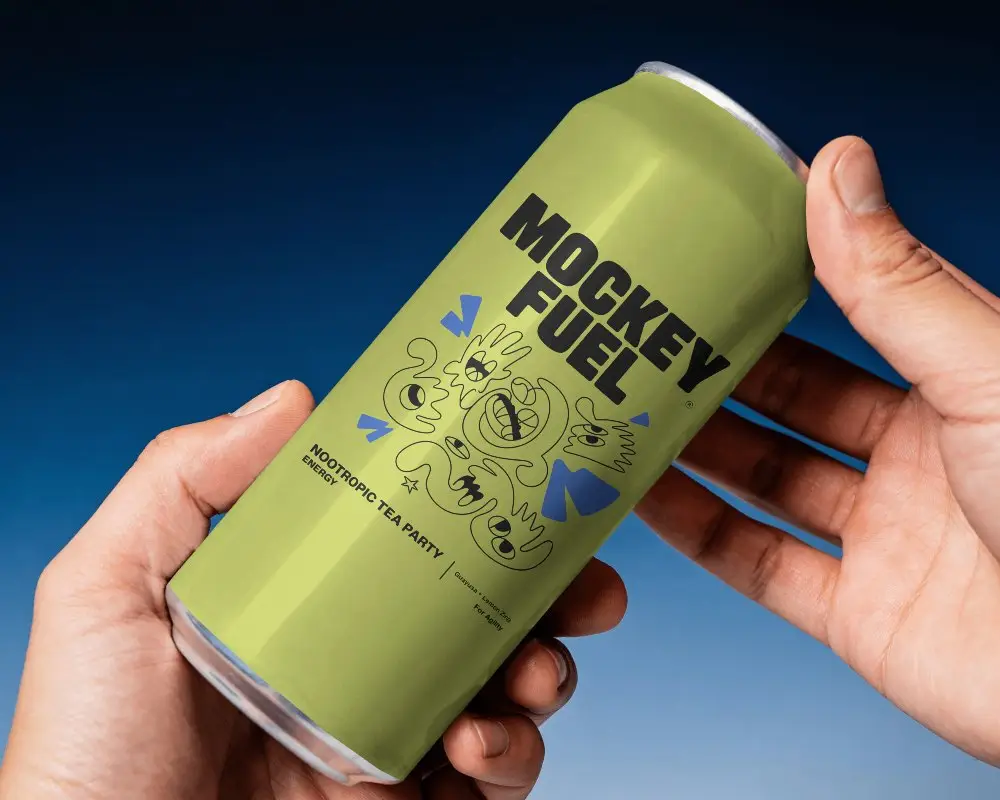 Two Hand Beer Can Mockup On Blue Studio Background With Close Up Product Hold And Premium Lighting