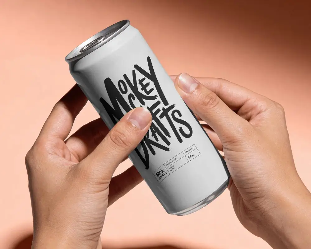 Two Hand Coffee Can Mockup On Warm Peach Studio Background With Soft Shadow And Premium Lighting