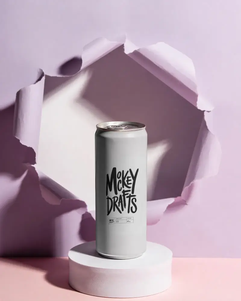 Slim Beverage Can Mockup On Pedestal With Torn Paper Wall For Product Presentation