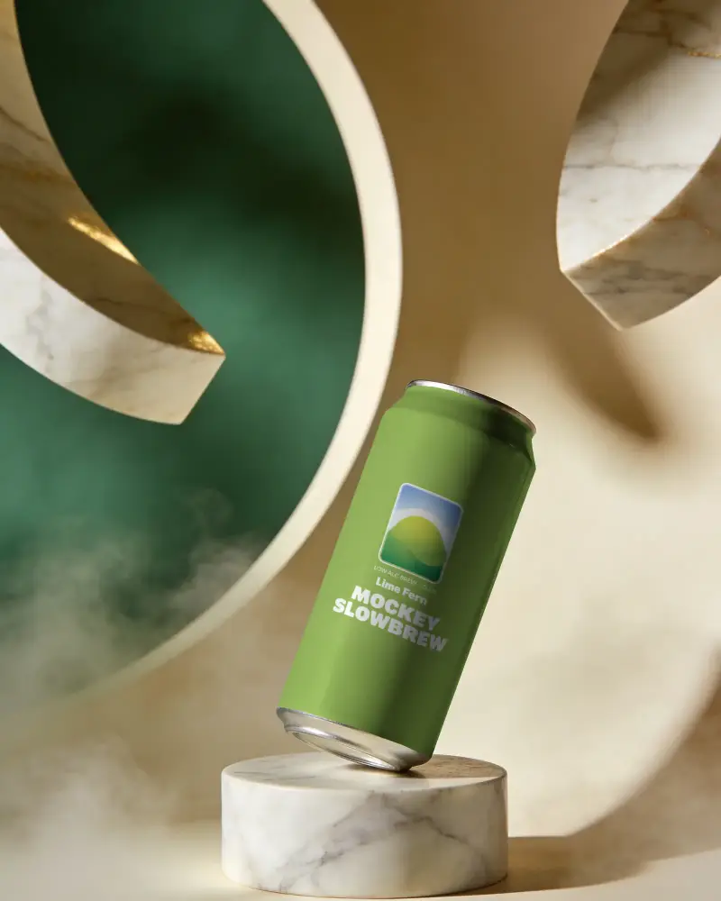 Sleek Modern Beverage Can Mockup On Marble Stand With Artistic Background Design Elements