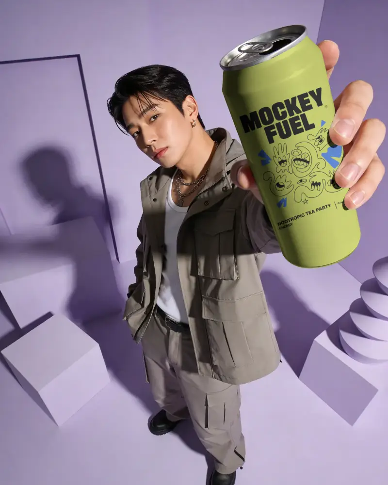 Stylish Man Holding Tall Slim Can Mockup For Refreshing Beverage Brand Promotion