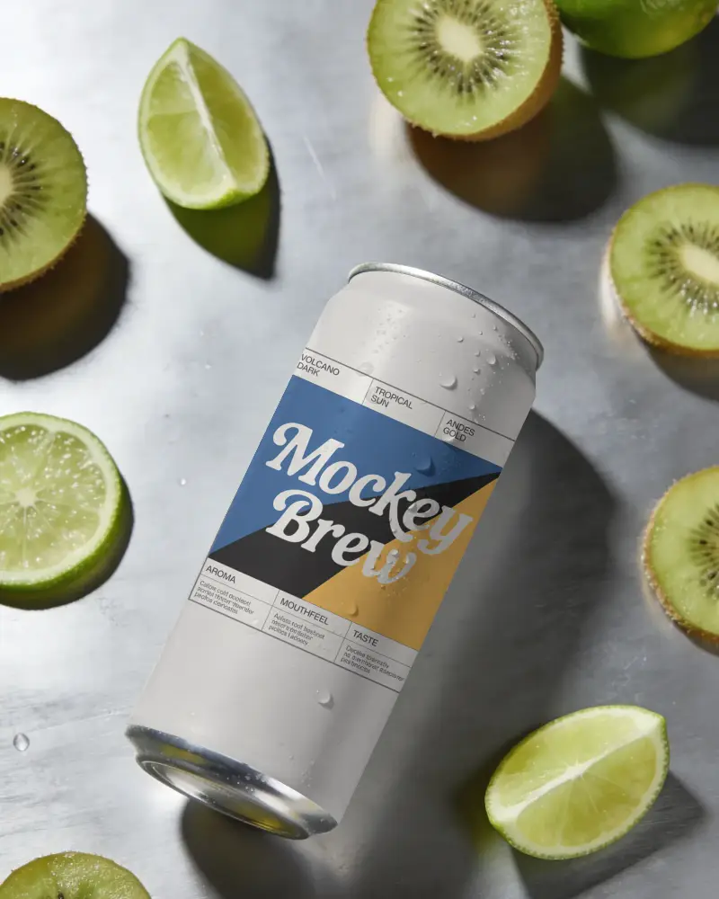 Sleek Drink Can Mockup Surrounded By Kiwi And Lime Slices On Metallic Surface